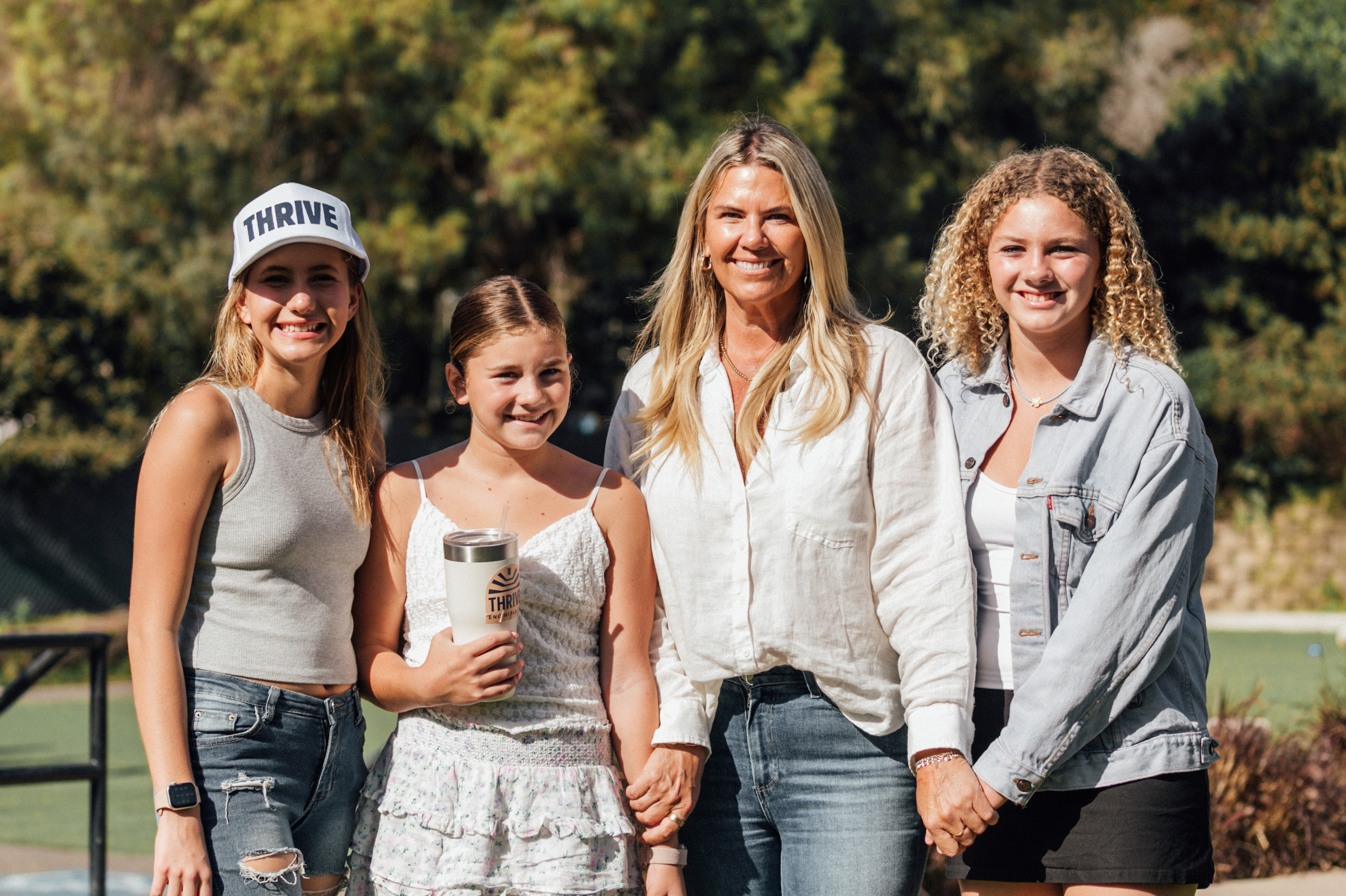 A Thrive mom and her daughters on campus
